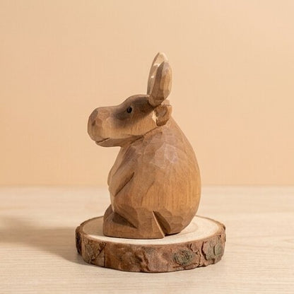 Back view hand carved wooden moose figurine showing antler and body details, natural wood grain finish eco-friendly toy, safe non-toxic wooden animal figurine for Montessori homeschool woodland play