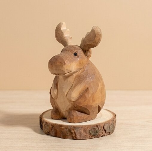 Top detail view wooden moose figurine toy showing hand carved texture and antlers, non-toxic stained natural wood eco-friendly figurine, sustainable wooden animal toy gift for children ages 1-5 years