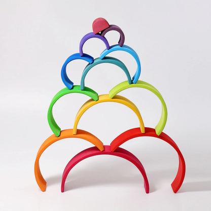 Colorful ring stand with rainbow-colored rings on a white background