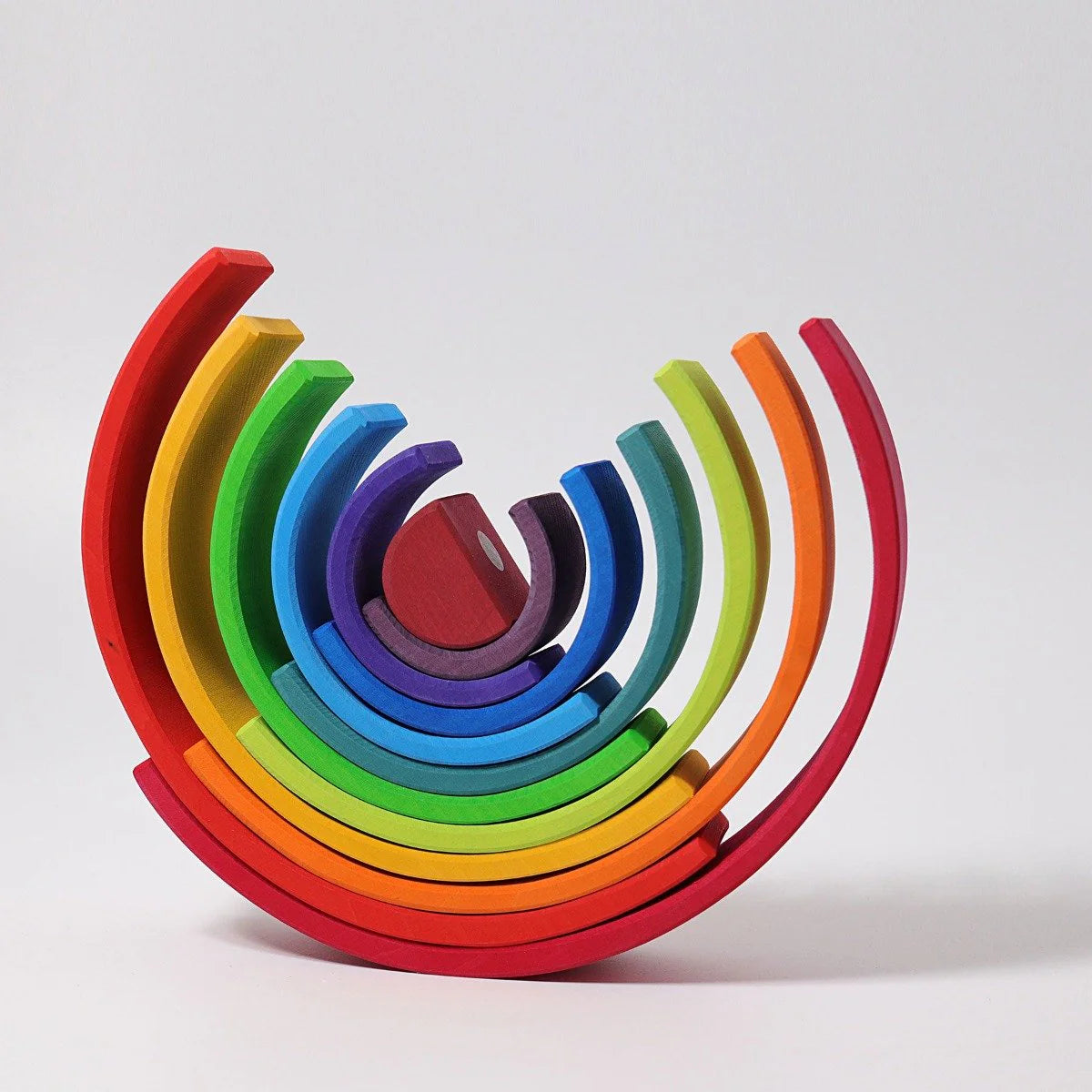 Colorful wooden toy with rainbow pattern on a white background