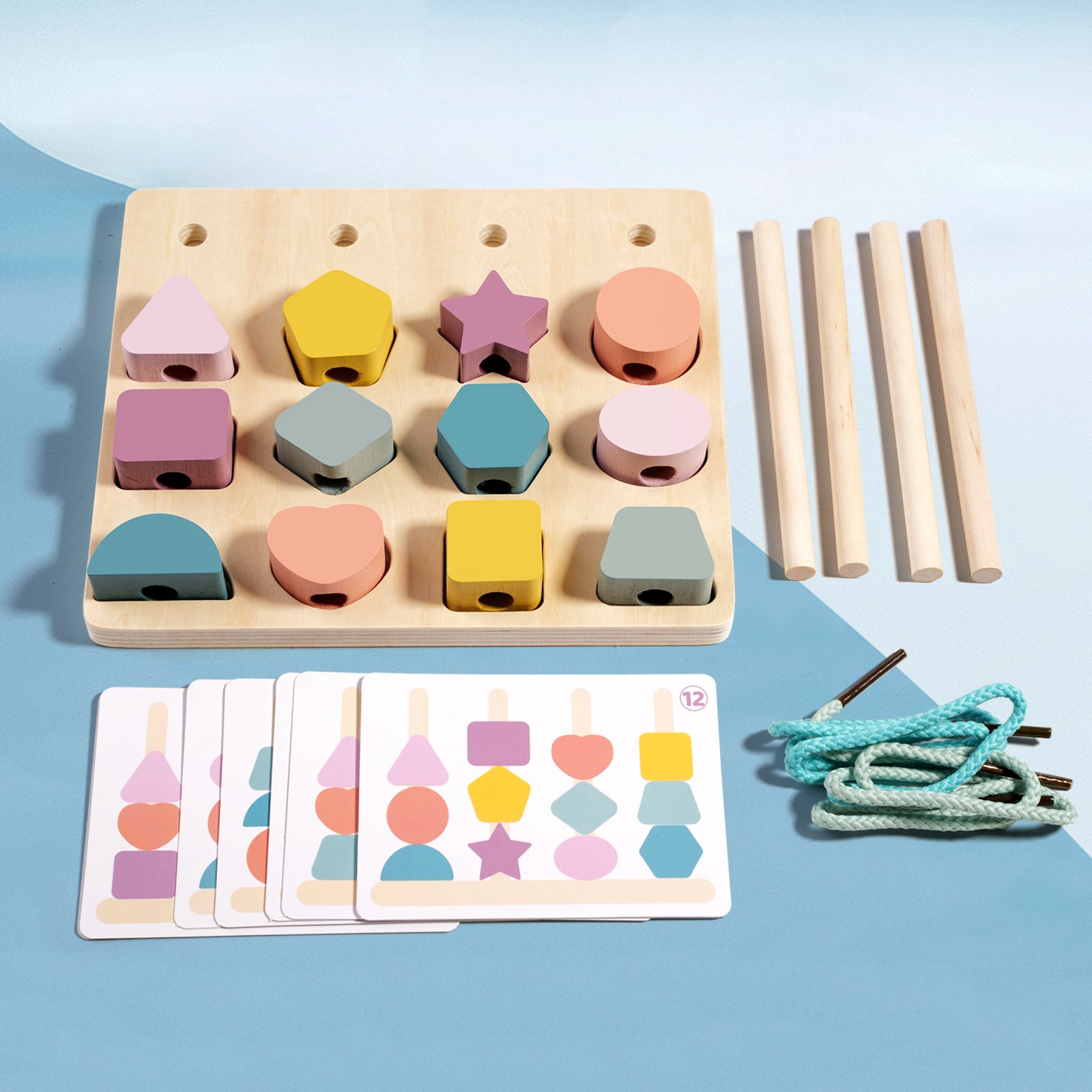 Wooden shape sorting puzzle with colorful shapes, cards, and sticks on a blue background