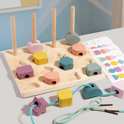 Wooden shape sorting toy with colorful blocks on a light surface.