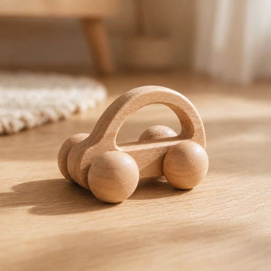 Natural beech wood baby push car toy with smooth one-piece wheels, a minimalist Montessori wooden car designed for toddlers, safe, quiet, and perfect for little hands on hardwood floors