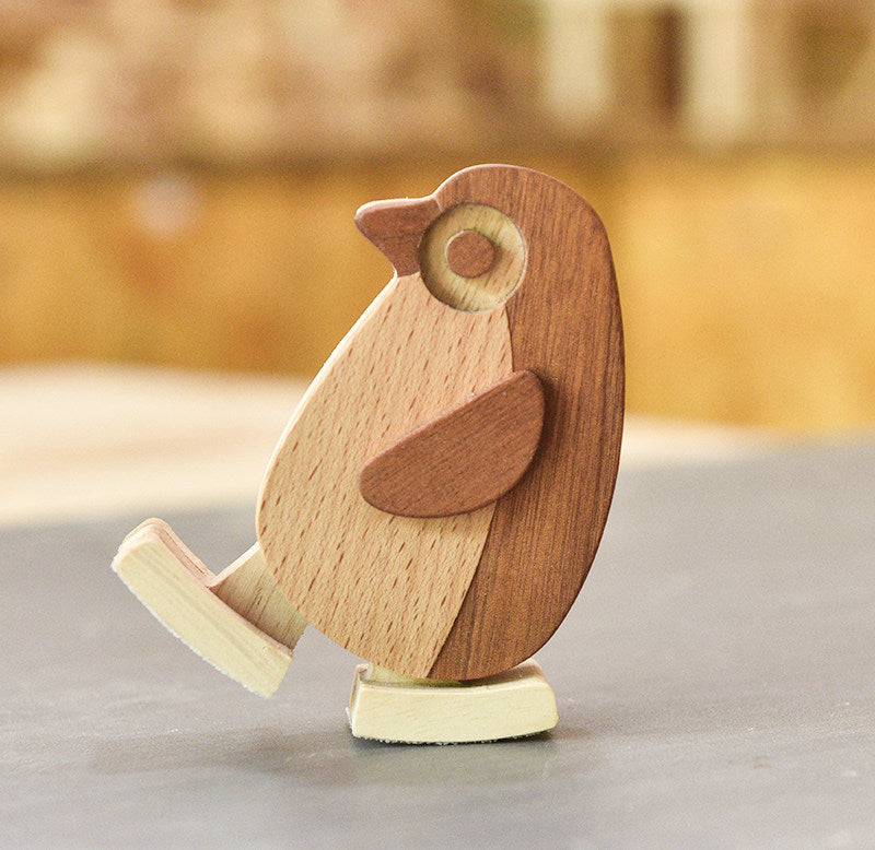 Newtonian physics penguin ramp walker toy for screen free toddler play.