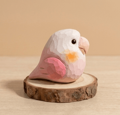 Side profile pink wooden lovebird toy with orange cheek detail, faceted low-poly design handpainted wooden bird figurine eco-friendly toddler toy gift