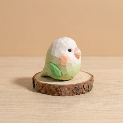 Green and white wooden lovebird toy with pink cheeks, handpainted low-poly bird figurine natural wood craft sustainable Montessori toy for toddlers imaginative play