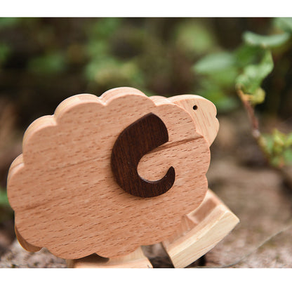 Artisan made wooden sheep walking animal using kinetic energy and gravity.