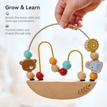 Wooden baby toy with colorful beads and animal figures, held by a hand against a light background.