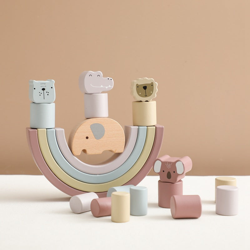 Wooden toy set with animal shapes on a beige background