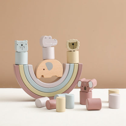 Wooden toy set with animal shapes on a beige background