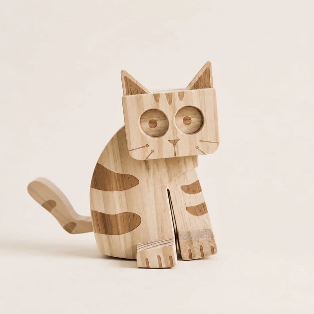 A wooden cat ramp walking toy with a natural light wood finish and darker brown grain patterns, shown against a solid, warm off-white background.