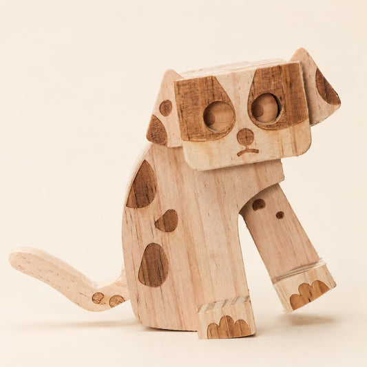 Close-up of a handmade wooden dog ramp walker toy with dark wood spots, carved paws and tail.