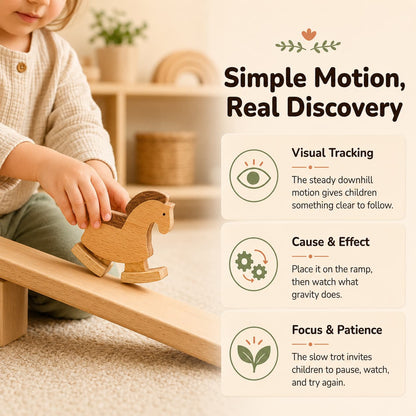 Toddler placing a wooden horse ramp walker toy on a sloped ramp, showing visual tracking, cause and effect, and focused screen-free play.
