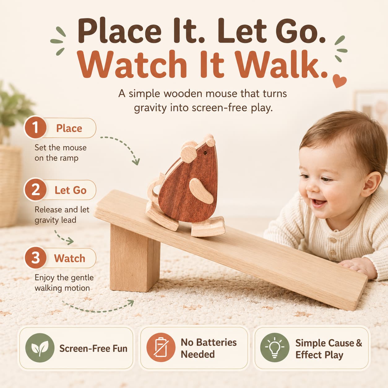 A baby smiling at a wooden mouse ramp walker toy sliding down a slope, demonstrating a screen-free and battery-free gravity powered walking motion.