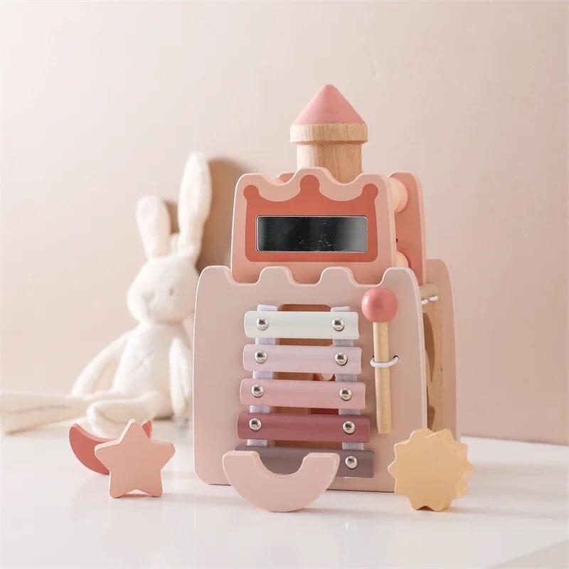 Wooden toy with pink and beige colors on a light background