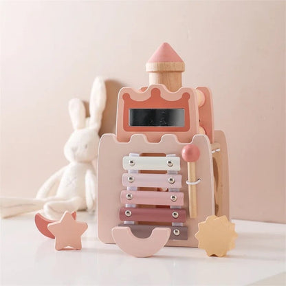 Wooden toy with pink and beige colors on a light background