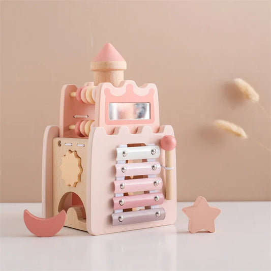 Wooden toy with pink and beige colors on a light background