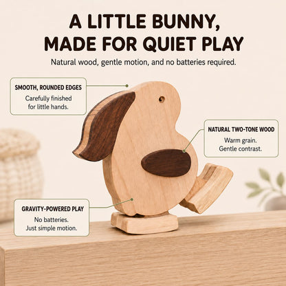 A wooden rabbit ramp walker hopping down a ramp, demonstrating visual tracking and cause-and-effect play for toddlers.