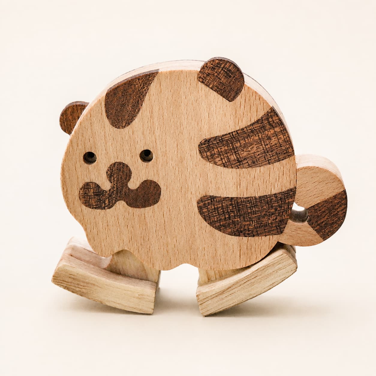 Handmade wooden tiger ramp walker toy with dark wood markings and articulated walking feet