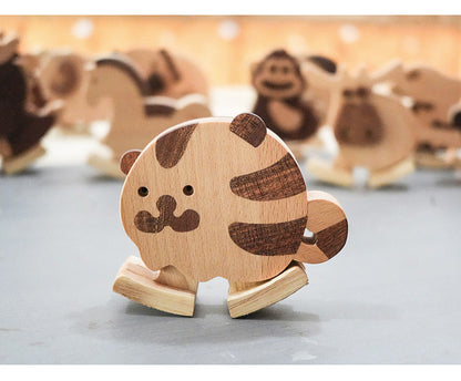 Wooden tiger ramp walker toy with striped details displayed alongside other wooden ramp walking animals from the collection.